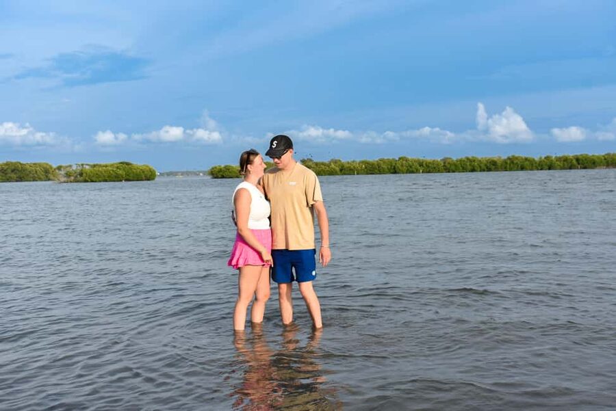 Negombo: Sunset lagoon boat tour with hotel transfers - The shallow lagoon walk, bench rest, and fruit in the water