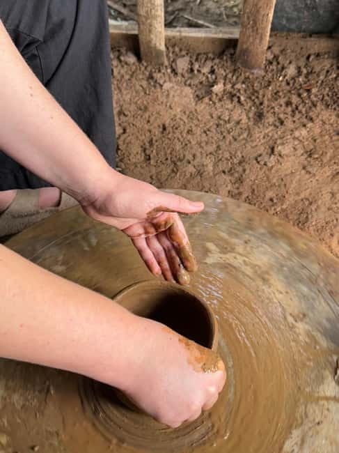 Yala Village Tour: Pottery Class, Lake and Temple Visits - Pottery class at a family-run workshop, hands in the clay